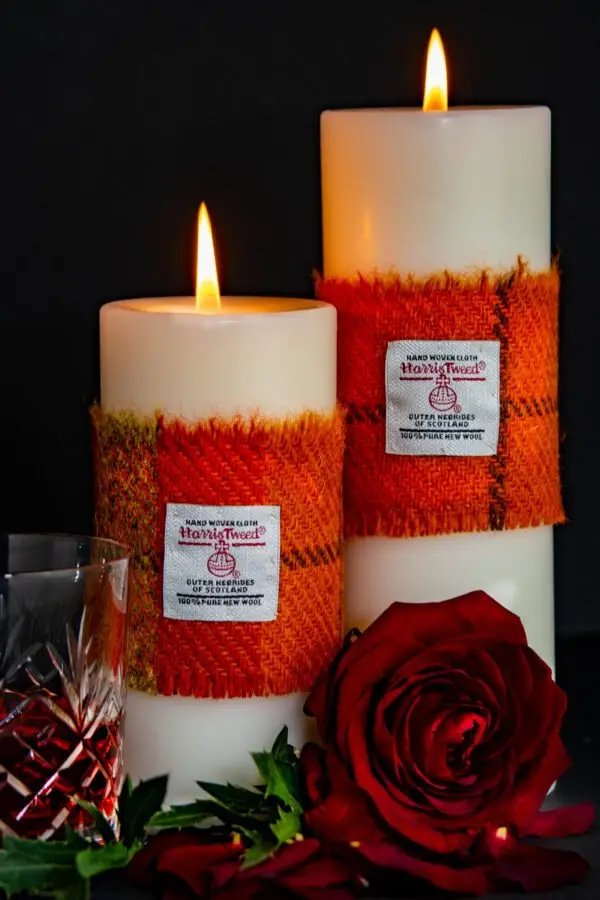 Pillar Candles with orange Harris Tweed® sleeve
